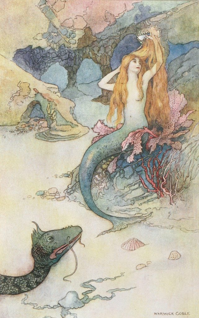 A Mermaid sitting on a rock